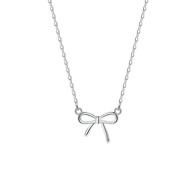 holding s925 sterling silver light luxury pearl bow dual layer stack wearing necklace female korean summer versatile clavicle chain