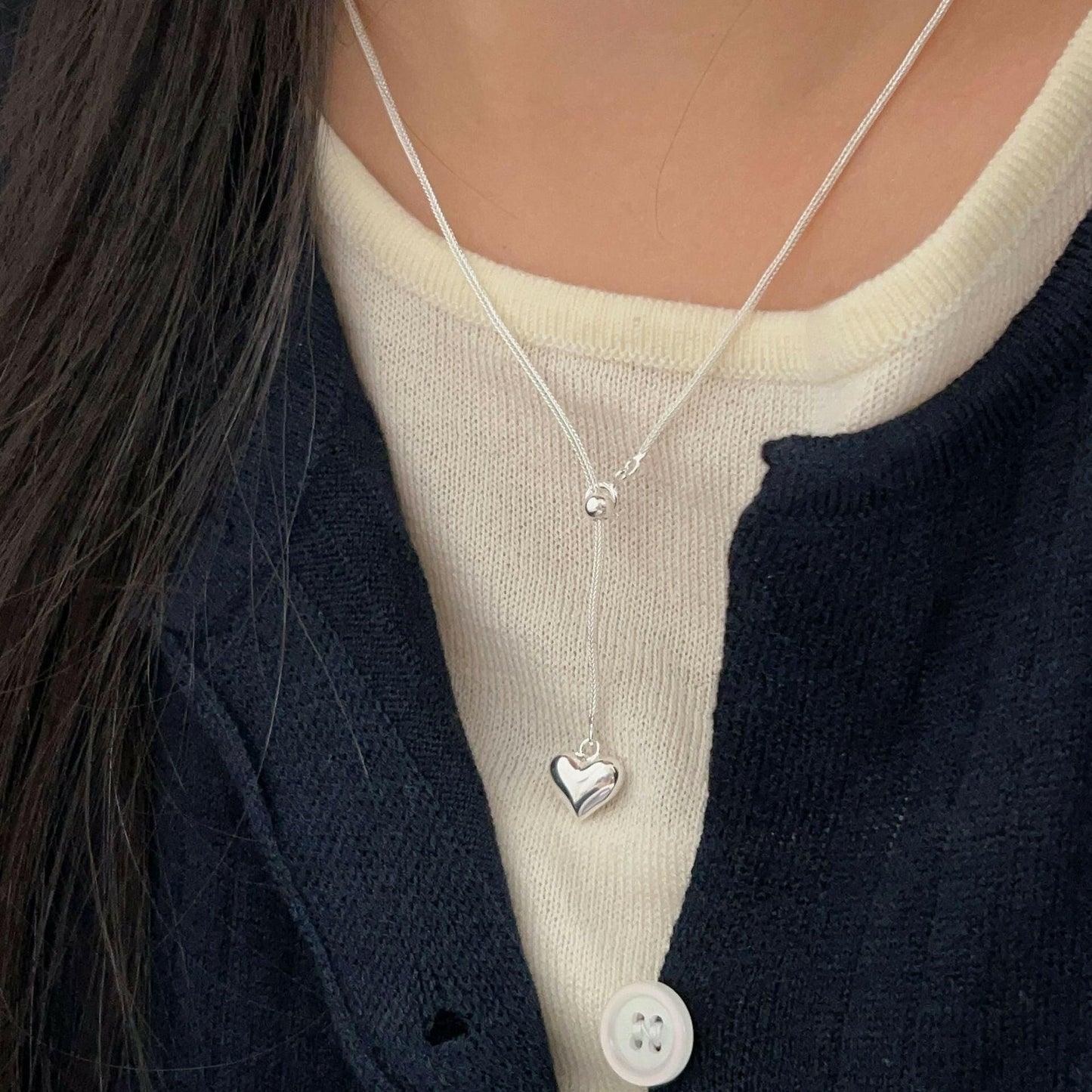 holding the heng s925 sterling silver love stretch necklace female niche design sensor clavicle chain 2024 korean version of the new tide